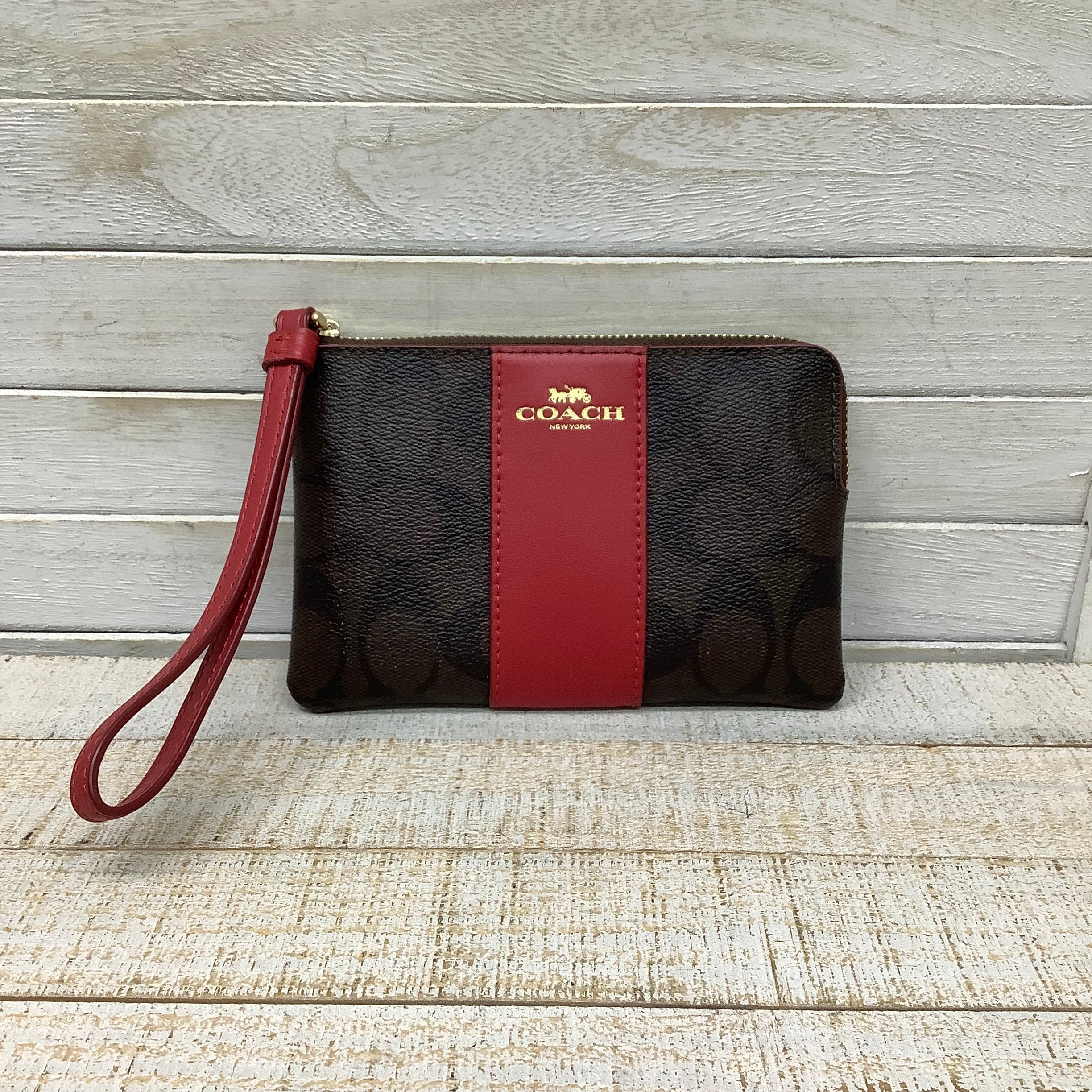 Wristlet Designer by Coach. Size Medium