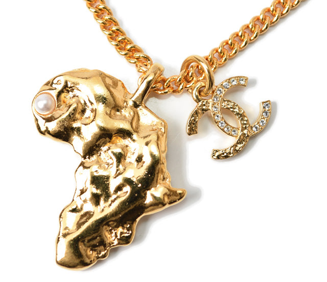 Top Quality Chanel Necklace/Pendant Chain with African Motif. CC Rhinestones. Gold