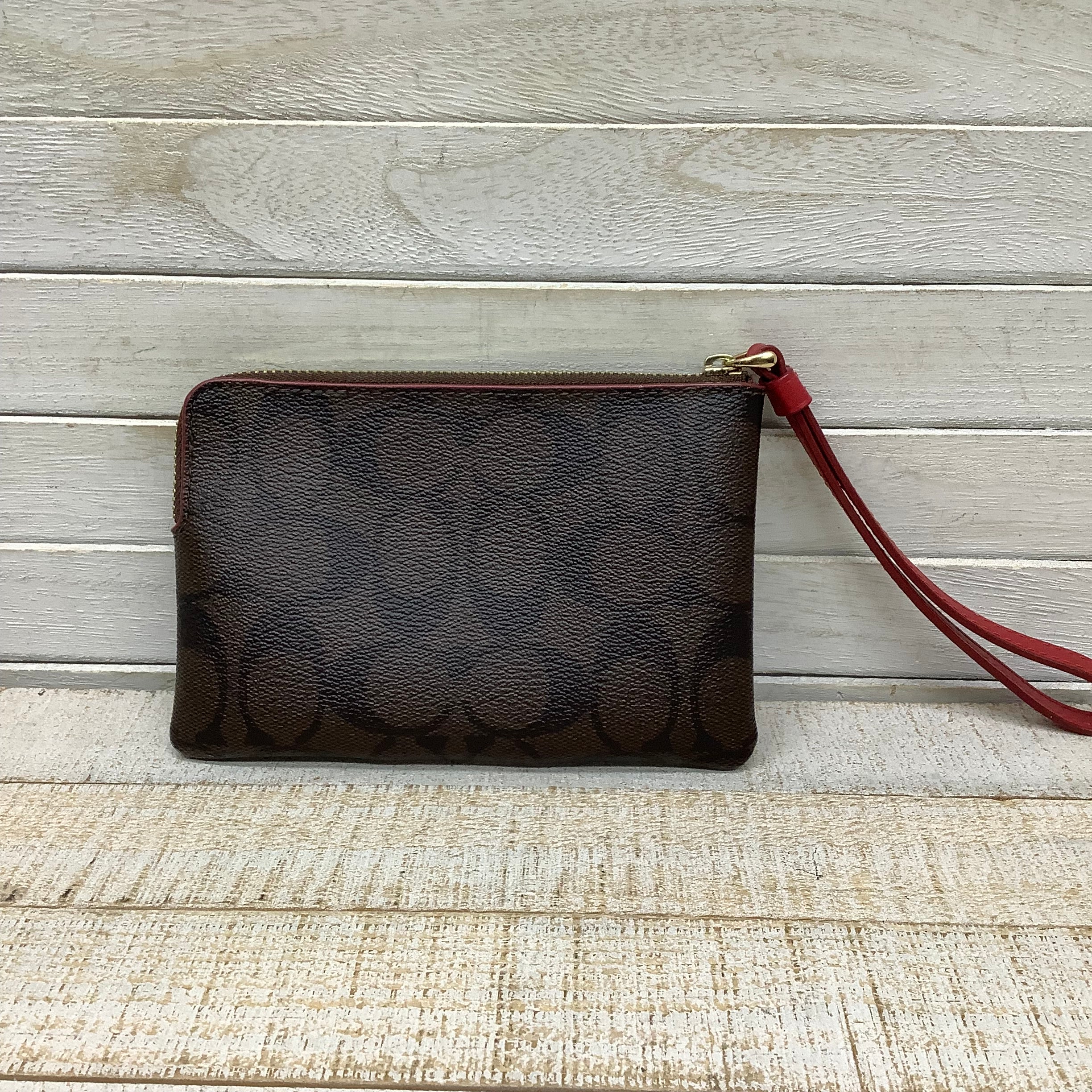 Wristlet Designer by Coach. Size Medium