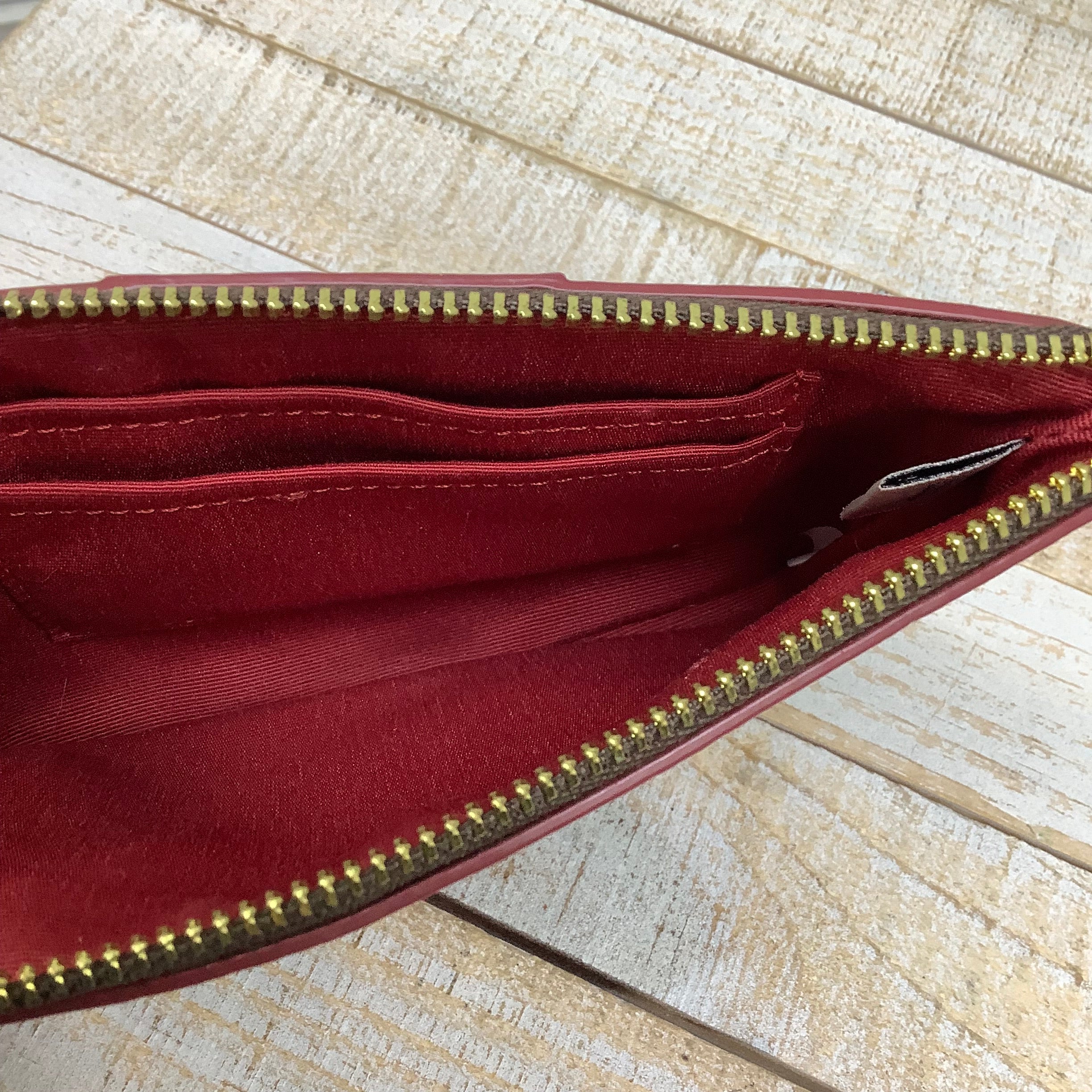 Wristlet Designer by Coach. Size Medium