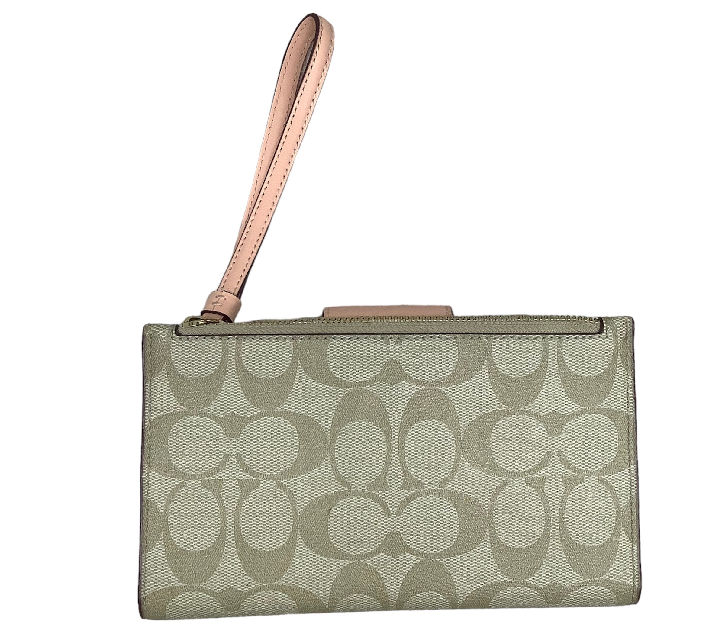 Tan Wristlet Designer by Coach. Size Medium