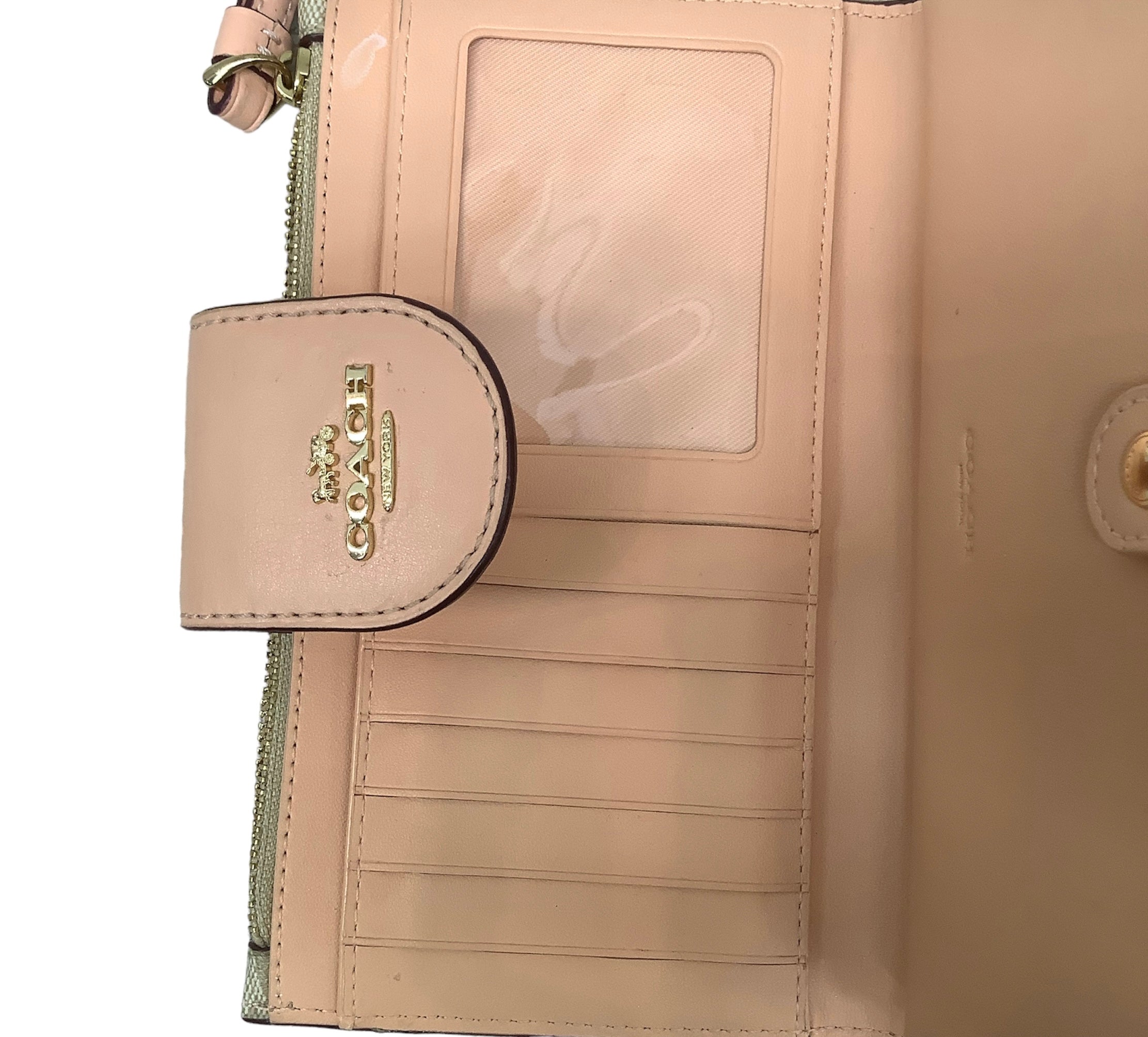 Tan Wristlet Designer by Coach. Size Medium