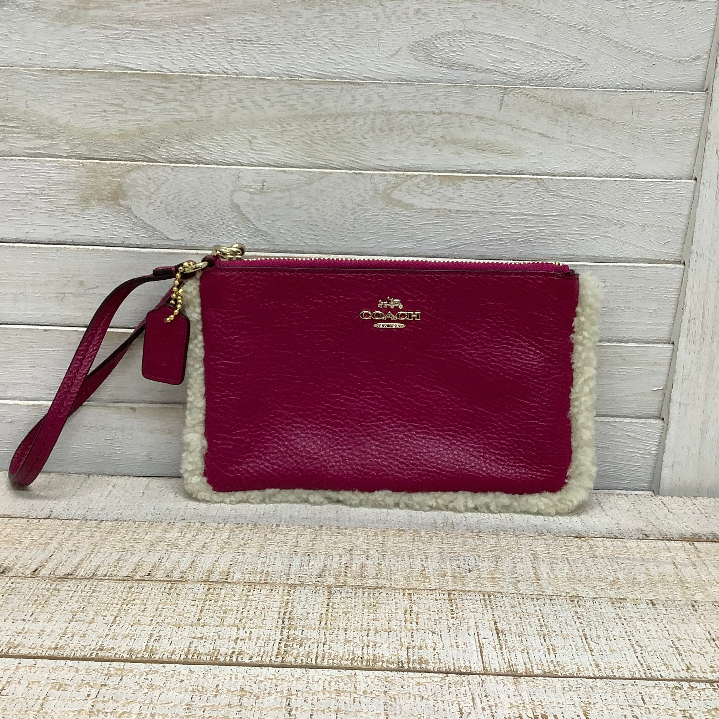 Wristlet Designer by Coach. Size Medium