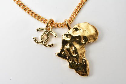 Top Quality Chanel Necklace/Pendant Chain with African Motif. CC Rhinestones. Gold