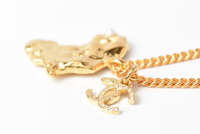 Top Quality Chanel Necklace/Pendant Chain with African Motif. CC Rhinestones. Gold