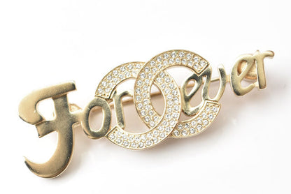 Top Quality Chanel Brooch with Rhinestones and Coco Mark. Gold